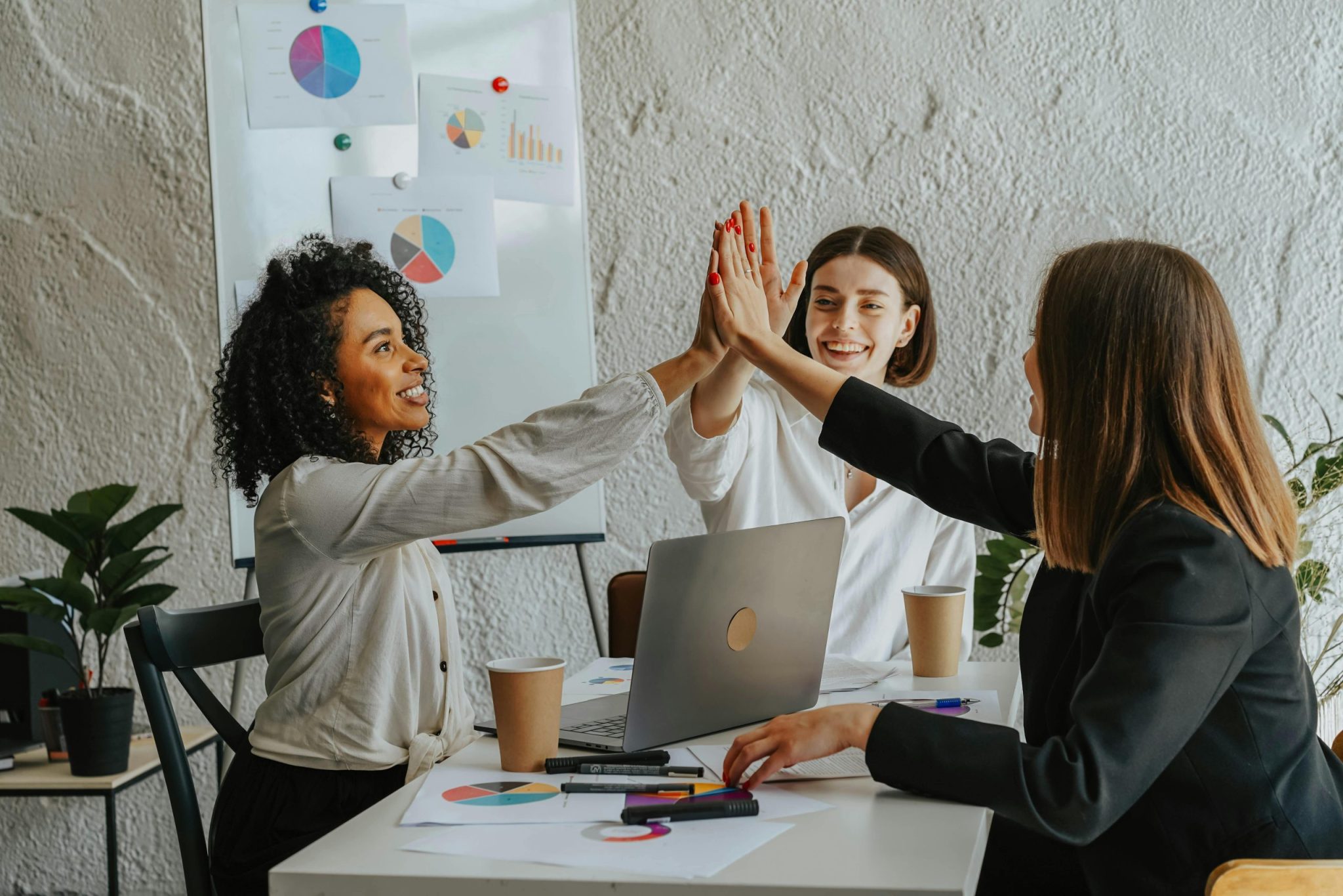 Group of woman clapping hands together